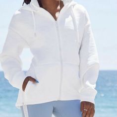 New With Tags Fabletics Lotta Removable Hood Zip Up Jacket White Camo Size: S - 4/6 Chest: 43” Front Length: 24, Back 26.5” Sleeve: 21” (External) Pocket Front Closure Fabric & Care 91% Polyester/9% Elastane White Athleisure Activewear With Drawstring Hood, White Athleisure Hoodie For Workout, Sporty Activewear With Adjustable Hood For Workout, White Activewear With Drawstring Hood For Workout, White Drawstring Hood Activewear For Workout, White Drawstring Hooded Activewear For Workout, Sportswear Activewear With Adjustable Hood For Workout, Athleisure Activewear With Adjustable Hood, Functional White Activewear With Drawstring Hood