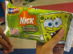 someone holding up a bag of spongebob snacks