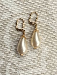 Medium-Sized Ivory Acrylic Faux Pearl Teardrop Pear Earrings with Gold or Antiqued Brass Plated Findings Pearl Teardrop Earrings, Teardrop Pearl Earrings, Pear Earrings, Wedding Accessories Jewelry, Gold Pearl Earrings, Vintage Pearls, Gold Pearl, Accessories Jewelry, Teardrop Earrings