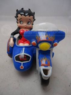 a toy motorcycle with a girl riding on it