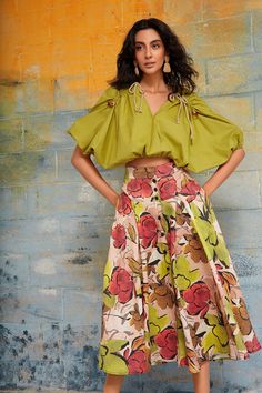 Made from the flax plant, a gentle crop that requires less water and energy to produce and printed on our custom botanical print without the use of water. This vibrant skirt features a high waist with encased elastic at the back for an accommodating fit. The seams are stitched with a contrast heavy thread and the closure is adorned with metal functional snaps at the front. The drape and fullness of the skirt adds dimension and movement to the midi silhouette. It has side pockets and it's also av New York Fits Summer, Maximalist Skirt, Resort 2025, 2025 Aesthetic, New York Fits, Printed Long Skirt, Hibiscus Print, Autumn Palette, Flax Plant