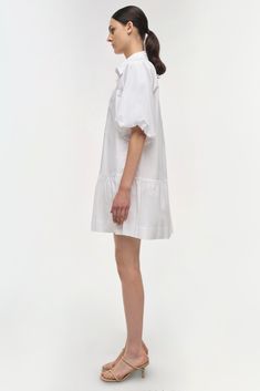 SIGNATURE COLLECTION The Crissy Dress in White. Casual, wear-everywhere shirting inspired mini dress with a relaxed, puffed fit and ballooned short sleeves. Casual Mini Dress, Crochet Midi Dress, Crochet Midi, One Piece Clothing, Mini Dress Casual, White Shirt Dress, Mini Shirt Dress, Knitwear Tops, Romper With Skirt