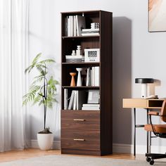 an office with a desk, chair and bookshelf in front of a window