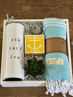 Come sail away with our coastal gift box 🏖️Nestled in a wooden storage tray is our perfect beach lover gift , SEA SALT SUN  stainless lined tumbler with stainless steel straw, Teal Turkish beach towel with tassel fringe , Swedish dreams Sea Salt Lemon bath bar , Sweet violet lip balm and decorative succulent.  Delivered wrapped in cellophane and ribbon with personalized gift card. Vacation Beach Gift Basket, Beach Season Woven Bag Gift, Beach Inspired Welcome Baskets, Beach Themed Gift Basket, Bahamas Gift Basket, Vacation Gift Ideas, Lemon Bath, Beach Lover Gifts, Sweet Violets