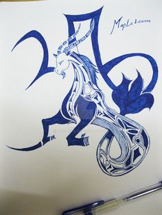 a drawing of a blue dragon on white paper