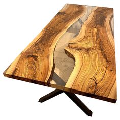 a wooden table that has been made out of wood and is shaped like a wave