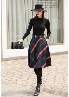 "This winter wool skirt is a classic piece of tailoring that will see you through rain or shine. It is cut with a flattering flared skirt to give you a wonderful shape. The winter skirt is perfect classic styling. This is a versatile skirt that you'll wear again and again. DETAILS: * 30% wool, 30% fiber, 40% polyester * fully satiny liner * Two side pockets * Right zip closure * A letter Back elastic, comfortable wear * Plus size full skirt * Perfect for Winter, autumn * Learn More about the ite Retro A-line Winter Skirt, Winter Lined Midi Pencil Skirt, Winter Knee-length Lined Pleated Skirt, Winter Knee-length Mini Skirt For Workwear, Fall Workwear Full Mini Skirt, Elegant Plaid Knee-length Skirt, Full Mini Skirt For Workwear In Fall, Fall Knee-length Pleated Mini Skirt, Elegant Knee-length Plaid Skirt