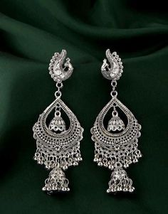 Base Metal-Alloy, Silver Platting Stone-Artificial Stone and Beads Sizing- Non adjustable Stylish Silver Oxidized Indian drop Earrings- An Eternal Classical Design. These Vintage earrings will complement any Occasion Ethnic Wear/ Daily / College / Party Wear. Produced under Quality Control; One by One Checking; Focus on Detail Processing. Top Quality/ Latest Trend Design/Anti-Allergy Beautiful Looks at One Glance- with Intricate High Polish creates Glamorous Reflections and adds Luxurious Looks. Traditional Metal Chandelier Earrings For Party, Traditional Peacock Design Danglers For Party, Traditional Peacock Danglers For Party, Traditional Metal Chandelier Earrings For Festivals, Navratri Chandbali Jhumkas With Motifs, Peacock Design Danglers For Diwali, Festive Peacock Design Danglers For Diwali, Festive Peacock Design Danglers, Traditional Peacock Design Jhumkas Drop Earrings