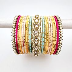 Beautifully designed bangles for any occasion. South asian bracelets come in a variety of styles, colors, and finishes. We at Banglez take creating the perfect bangle set for you to another level! You could say helping you find your favorite stack of bangles as one of our greatest missions. This bangle set was curated in house by one of our talented team members. We hope you love them as much as we do! Team Members, South Asian, Bangle Set, Mixed Colors, Color Mixing, Bangles, Finding Yourself, Color