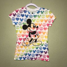 100% Polyester Mickey Mouse Rainbow Hearts Tee Shirt White Themed Mickey Mouse T-shirt, Themed Cotton Shirt With Mickey Mouse, Fun Multicolor Cartoon Print Tops, Multicolor Disney T-shirt For Summer, Multicolor Disney Crew Neck T-shirt, Mickey Mouse Themed Cotton Top, Summer Cartoon Print Shirt For Disney Fan Events, Themed Mickey Mouse Cotton Top, Multicolor Short Sleeve T-shirt For Disney Fans