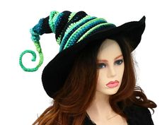 Ready for the Renfaire, a festival, cosplay, a pagan celebration, your table centerpiece, or just plain fun, this witch or wizard hat is firmly structured but soft to wear. You can shape this hat just about any way you like because both the tip and the brim are wired. I crocheted this in a fun blend of greens and black, with a solid black brim.  The tip can be shaped to curl or spiral and the stacked layers allow for fun curves or straight up. You can shape the brim to slant over your face, curve up on one side, or wear it flat. When you're not wearing it, you can toss it on your table for a great conversational centerpiece, or hang it on a hook by the door! Folds flat for travel. -This soft witchy hat has some stretch so it will fit between 21" to 23.5" head circumference. -3.5" brim How Whimsical Adjustable Costume Hats For Carnival, Whimsical Adjustable Costume Hats And Headpieces For Carnival, Themed Hats For Costume Party And Carnival, Themed Hats For Carnival Costume Party, Themed Carnival Costume Hat, Witchy Winter Hats For Party, Adjustable Hats For Halloween Costume Party, Witchy Adjustable Winter Hats, Witchy Winter Costume Hat