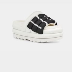 Ugg Women's Maxi Slide Logo Sandal Trendy White Sandals With Rubber Sole, White Rubber Sole Flip Flops For Spring, White Platform Casual Flip Flops, White Casual Platform Flip Flops, Casual White Platform Flip Flops, White Synthetic Slide Platform Slippers, White Synthetic Sandals With Textured Sole, Casual White Sport Sandals With Textured Sole, Casual White Leather Platform Slippers