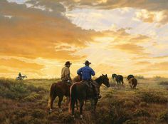 two men riding horses in a field at sunset with cattle behind them and the sun setting