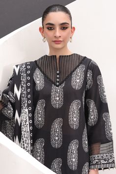 Brand: ZellburyProduct Code: WUS24X31525Collection: Zellbury Lawn Unstitched Monochrome CollectionFabric: Lawn PRODUCT DESCRIPTION: This Shirt Shalwar Dupatta in classic black is designed for women, featuring a beautiful printed fabric made of high-quality Lawn material. The unstitched ensemble includes a lawn dupatta and a bottom cambric for versatile styling options. Elevate your wardrobe with this elegant piece. PRODUCT DETAILS: Digital Printed Lawn Shirt 2.5M Digital Printed Lawn Dupatta 2.5M Dyed Cambric Trouser 2.5M DISCLAIMER:* Lining, Laces, and Tassels are not included in unstitched variants.* Embellishment items in stitched outfits are subject to market availability.* Product color may vary due to photographic lighting or your device settings. CARE INSTRUCTIONS: Extra Fabric Has Shirt Trouser Designs, Printed Trouser Design, Lawn Printed Suit Design, New Shalwar Design, Printed Suit, Unstitched Patterned Lawn Suit For Summer, Elegant Unstitched Lawn Suit, Lace Designs On Suits, Elegant Semi-stitched Printed Lawn Suit