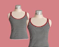 This tank is a classic staple for your wardrobe! It has slim black and white stripes and the neckline/straps are lined with red fabric. It is super stretchy so it can fit a variety of sizes! Wear with a pair of red sunglasses and enjoy the summer sun!  Sizing: Bust- unstretched (15") stretched (21.5") Waist: unstretched (14") stretched (24") As always, it's important to mention that all my vintage items are sold 'as-is,' and I cannot accept returns. I encourage you to thoroughly inspect the pict Fitted Tank Top With Contrast Stripes For Spring, Striped Fitted Tops With Tank Straps, Fitted Striped Tops With Tank Straps, Sleeveless Cotton Tank Top With Contrast Stripes, Striped Fitted Tank Top With Tank Straps, Cotton Sleeveless Tank Top With Contrast Stripes, Fitted Sleeveless Top With Contrast Stripes, Fitted Striped Tank Top, Fitted Striped Tank Top For Spring