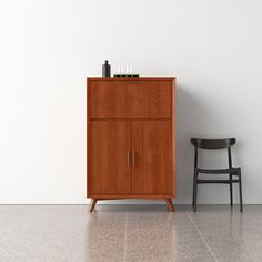 a wooden cabinet next to a black chair