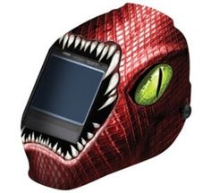 an image of a red dinosaur mask with a cell phone in it's mouth