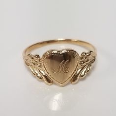 "Thanks for shopping our vintage estate store. We tend to sell well below wholesale and truly hope you enjoy all of our items. Many of the items are one of a kind, so please enjoy scrolling through the pictures and hopefully something will catch your eye. Brown spots are from camera or reflections. Estate 14k yellow gold monogram cursive capital M heart ring. Custom made ring for our shop. Ring size: 3 Setting: 7.5mm 1/4\" to 3/8\" Band width: 1.4mm Weight: 1.09 grams Marked 14k and it's sweet. Mariah Core, Cursive M, Antique Style Rings, Lifestyle Women, Dope Jewelry, Gold Link, Gold Monogram, Funky Jewelry, Jewelry Lookbook