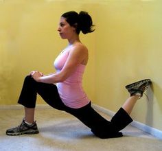 a woman is doing an exercise on the floor