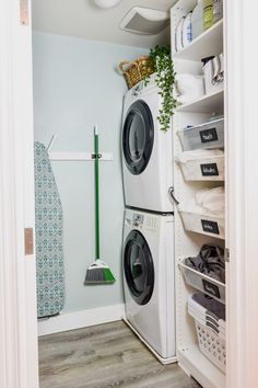 a washer and dryer sitting in a closet next to each other on shelves