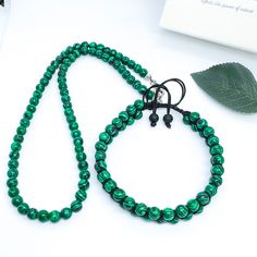 Welcome to our store ❤💕 ►► If you are looking for a Boho Style Necklace Bracelet Set, this product is for you! ► This is our necklace and bracelet; It is made of 6mm green malachite beads. ► Boho necklace and bracelet It is also a real Tribal necklace and bracelet set! ► Our necklace is designed with stainless steel rope. Our wristband is designed with durable parachute rope. Both are adjustable.  ►► Who can buy this product? ► Perfect choice for those who love bohemian necklaces and bracelets! Malachite Jewelry With 8mm Round Beads, Adjustable Beaded Malachite Necklaces, Adjustable Beaded Malachite Necklace, Malachite 8mm Beads Jewelry Gift, Beaded Malachite Necklaces, Adjustable Green Beaded Necklaces Hand Wrapped, Adjustable Green Hand-wrapped Beaded Necklaces, Adjustable Green Hand Wrapped Beaded Necklaces, Adjustable Green Hand Wrapped Beaded Necklace