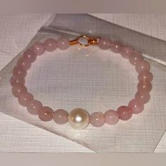 This Beautiful Handmade Bangle Is So Pretty. It's Made With Semiprecious Stone Pink Quart 8mm Beads With A 12mm Mother Of Pearl Shell Focal Bead On Cooper Wire..So Pretty This Fits For A Larger Wrist Like 8 Inch 9 Inch Or 10 Inch Fitted Or Lose For Some.This Makes A Great Gift Idea Or Keep For Yourself. Comes With Free Gift. Elegant Pink Bracelets With Large Beads, Pink Hand-wrapped Bracelets With Round Beads, Handmade Pink Crystal Round Bracelet, Pink Agate Round Bead Crystal Bracelet, Pink Pearl Bracelet With Hand-strung Round Beads, Kate Spade Bracelet, Pink Pearl Bracelet, Amethyst Bracelet Beads, Vintage Bangle Bracelets