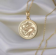 🐉 Step into the enchanting realm of Chinese New Year with our mesmerizing dragon necklace! 🎉 Crafted with meticulous attention to detail, this exquisite piece is a vibrant celebration of tradition, strength, and auspicious beginnings. Imagine the majestic dragon, intricately designed with shimmering scales ✨ and fierce claws, symbolizing power and resilience. With each wear, you'll embody the spirit of this mythical creature, carrying with you the energy of the Lunar New Year. 🌟 * Gender : Male / Female * Material Options : Silver, Gold Plated, Rose Gold, 14K Solid Gold * Thickness of Silver Pendant: 1.0 mm * Thickness of Gold Pendant: 0.8 mm * The Gold Plated and The Rose Gold Plated options are applied to 925 Sterling Silver with solution that contains 14K Gold. * There are several op Majestic Dragon, Mythical Dragons, Mythical Creature, Dragon Necklace, Crafts Jewelry, Dragon Pendant, Chinese Traditional, Lunar New Year, Timeless Accessories