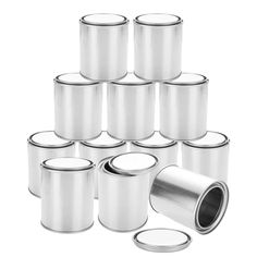 a bunch of tin canisters are stacked together