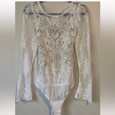 Gorgeous Lace Body Suit With Silver Sequin Detail And Laced Open Back - Brand New With Tags Perfect For Holidays Sold Out Online ! Backless Lace Bodysuit For Summer, Summer Lace Bodysuit For Night Out, White Fitted Backless Bodysuit, Elegant Party Bodysuit For Spring, Elegant Spring Party Bodysuit, Party Lace Bodysuit, Backless Party Bodysuit With Lace Trim, Party Backless Bodysuit With Lace Trim, Backless Bodysuit With Lace Trim For Party