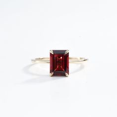 Emerald Cut Garnet Engagement Ring in Solid Gold - Red Garnet January Birthstone, Anniversary Gift Ring for Her This elegant emerald cut garnet engagement ring features a stunning red garnet set in solid gold. As the January birthstone, it makes a perfect anniversary or special occasion gift for her, blending classic beauty with a personal touch. Same design can be made also with other custom gemstones per request.  Product details: Stone - Natural Garnet Size - 6x8 Color - Red Metal - Solid Gol Fine Jewelry Garnet Ruby Ring With Bezel Setting, Classic Red Sapphire Promise Ring, Red Baguette Cut Lab-created Ruby Ring, Red Sapphire Ring Fine Jewelry Birthstone, Garnet Ring With Prong Setting, Formal Garnet Birthstone Ring In Fine Jewelry Style, Formal Garnet Birthstone Ring Fine Jewelry, Fine Jewelry Garnet Ring, Classic Lab-created Ruby Birthstone Ring As Gift