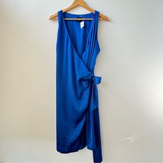 New With Tags Gap Royal Blue Satin Wrap Dress Size L. In Near Perfect Condition But Does Have One Tiny Flaw Noted In The Last Picture Looks Like One Of The Threads Got Caught. I’m Not Sure If I Did This In Trying It On Once Or I Got It Like This :/ Priced Accordingly! It’s Honestly Barely Noticeable. I Try To Ship Next Day (Or Same Day When Possible)! Please Let Me Know If You Have Any Questions. All Measurements Are Approximate. P2p: 19” No Stretch Length: 39” Elegant V-neck Gap Dress, Blue Midi Length Wrap Dress For Evening, Chic Blue Wrap Dress For Summer, Chic Blue Summer Wrap Dress, Blue Midi Wrap Dress For Party, Blue Midi Length Wrap Dress For Beach, Blue Wrap Dress For Spring Evening, Blue Midi Length Wrap Dress For Summer, Blue Wrap Dress For Summer Evening