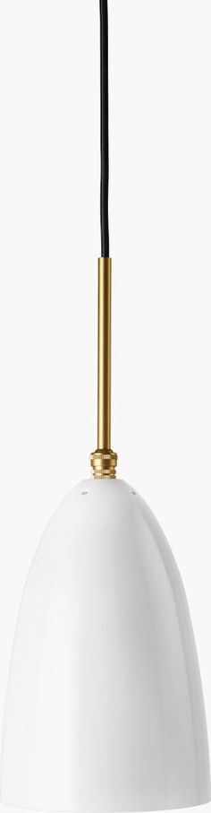 a white and gold pendant light hanging from a black cord on a white ceiling fixture