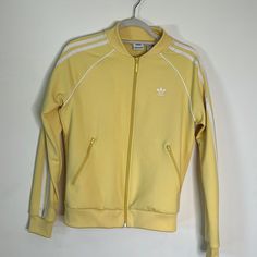 Adidas Jacket For Women Yellow Size Sm Brand New Worn Once Fitted Spring Track Jacket For Streetwear, Fitted Sporty Outerwear For Spring, Fitted Adidas Track Jacket For Winter, Adidas Track Jacket With Ribbed Cuffs For Spring, Adidas Long Sleeve Track Jacket For Spring, Adidas Spring Outerwear For Streetwear, Adidas Outerwear For Spring Streetwear, Adidas Streetwear Outerwear For Spring, Adidas Track Jacket With Ribbed Cuffs For Fall