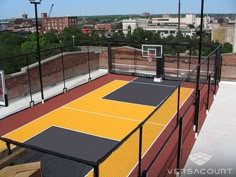 an outdoor basketball court on top of a building