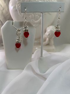 "\"Lovely Little Prince\" Necklace and Dangle Earring set made with Translucent Red Pressed Czech Glass and Silver Mini Crowns is a sweet and cherished little fairy tale of a love note." Red Nickel-free Jewelry For Valentine's Day, Nickel-free Red Jewelry For Valentine's Day, Nickel Free Red Jewelry For Valentine's Day, Adjustable Drop Earrings For Valentine's Day, Nickel-free Red Jewelry For Mother's Day, Handmade Red Jewelry For Mother's Day, Personalized Red Dangle Jewelry, Red Drop Earrings For Valentine's Day, Adjustable Ear Wire Jewelry For Valentine's Day