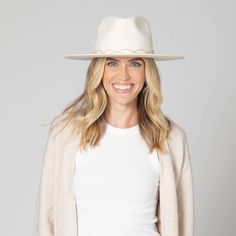 Introducing Amore - a luxurious wool fedora with a stiff brim and twisted rhinestone trim. The ivory color, organza back ties, and inner satin lining add a touch of elegance to this statement piece. With an adjustable fit and 3.5" brim, this fedora is perfect for any woman looking for sophistication and style. Features: Color: Ivory Material: 100% Wool Brim Size: 3.5" Size: 57cm Wool Felt Stiff Brim Fedora Twisted Rhinestone Trim Organza Back Ties Inner Satin Lining Adjustable Elegant Cream Wide Brim Fedora, Elegant Cream Panama Hat With Flat Brim, Elegant White Fedora With Flat Brim, Elegant Cream Fedora Hat, Elegant Beige Short Brim Fedora, Elegant White Flat Brim Fedora, Elegant Beige Fedora, Elegant Fitted Cream Panama Hat, Elegant Fur Felt Panama Hat For Fall