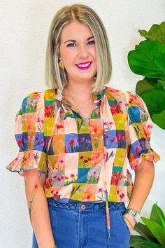 This cheerful gingham print, sprinkled with playful floral tulips, is just the thing to brighten up any day. Whether you're headed to a sunny picnic, a lively brunch with friends, or a casual day out, this top pairs perfectly with your favorite denim for a look that's effortlessly stylish. The button-down front adds a touch of vintage charm, making it a versatile piece that will keep your outfits fresh and fun all season long. PRODUCT FIT - TRUE TO SIZE MODEL DETAILS - BRENNA IS WEARING A SIZE S Playful Green Tops For Spring, Green Colorful Pattern Blouse For Spring, Spring Green Blouse With Colorful Pattern, Green Blouse With Colorful Pattern For Spring, Spring Green Top With Colorful Pattern, Green Top With Colorful Pattern For Spring, Spring Plaid Cotton Tops, Spring Green Tops With Colorful Pattern, Cute Tops With Fruit Print For Spring