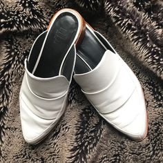 White, Worn Very Few Times. Flawless Aside From Bottom Of The Shoe Normal Wear. White Slip-on Mules With Padded Heel, White Slip-on Synthetic Mules, Modern Slip-on Mules With Buckle Closure, White Slip-on Mules With Buckle Closure, Slip On Mules, Mule Clogs, Mules Shoes, Clogs, Slip On Sneaker