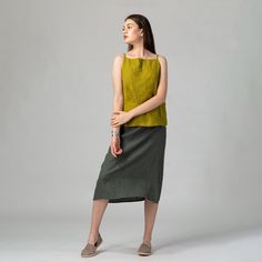 "Minimalist seasonless A-line linen skirt featuring an elasticated back waist for increased comfort and flattering fit and midi length which makes it easy to style with any top shape. Made of pure washed European linen for a perfectly soft feel and naturally wrinkled look. FIT The A-Line Skirt has a relaxed fit and sits slightly below the waistline. The intended positive ease around the hips is 8-12 cm/3.1-4.7\". To choose the right size, check out our body and garments measurements charts displ Versatile Green Relaxed Fit Skirt, Versatile Relaxed Mini Skirt For Summer, Versatile Relaxed Summer Mini Skirt, Summer Plain Relaxed Fit Skirt, Plain Summer Skirt, Casual Asymmetrical Pencil Skirt, Solid Summer Pencil Skirt, Summer Lined Pencil Skirt, Summer Solid Color Lined Pencil Skirt