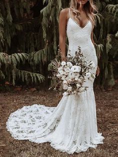 a woman in a wedding dress holding a bouquet