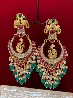 Premium quality High gold plated, pearl work, hand carved work , AD lining and kundan work. Clip back.  about 5.5 inch long  Absolute designer piece and statement earring. Luxury Kundan Danglers For Ceremonial Occasions, Luxury Green Chandbalis With Tilla Detail, Luxury Kundan Chandbali Chandelier Earrings, Luxury Ornate Chandbali Bridal Earrings, Luxury Cutdana Chandbalis For Festive Occasions, Luxury Multi-stone Chandbali Earrings, Luxury Green Chandbali Earrings, Luxury Green Chandbali Jhumkas, Luxury Festive Chandbalis With Peacock Design