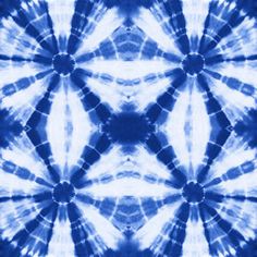 a blue and white tie - dyed background with an intricate design