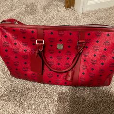 Mcm Travel Bag For Men And Women Like New Only Used Once Red Rectangular Travel Bag, Classic Red Bag With Large Capacity, Classic Red Bags With Large Capacity, Red Tote Travel Bag For Everyday Use, Red Travel Bag With Leather Handles, Classic Red Large Capacity Bag, Red Large Capacity Shoulder Bag For Business, Large Capacity Red Shoulder Bag For Business, Red Top Handle Travel Bag