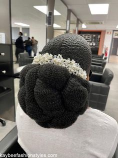 the back of a woman's head in an office setting