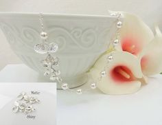 This orchid and Swarovski pearl link bridal necklace is gorgeous! This is a great necklace for the bride or bridesmaids! I would also be an amazing gift for the mother of the bride or groom! I offer discounts when you buy 3 or more of the same listing. Message me for prices and a custom listing. Scroll down for details, packaging and shipping, international orders, more products, and other important links! Please see pictures 4 and 5 for your pearl color and orchid finish options. This necklace White Floral Bridal Necklace For Wedding, White Flower Bridal Necklace For Wedding, Flower Shaped Pearl Charm Necklace For Wedding, Silver Flower Bridal Necklace For Wedding, Silver Pearl Bridal Necklace For Bridesmaid Gift, Delicate Silver Bridal Necklace For Bridesmaids, Bridesmaid Gift White Pearl Chain Bridal Necklace, Pearl White Flower Necklaces For Wedding, White Pearl Chain Bridal Necklace For Bridesmaid