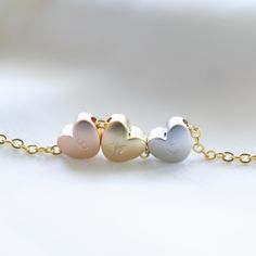 "Tri-Colour Heart Necklace the heart can be blank or personalised and comes on a rose gold, gold or rhodium plated chain. Excellent Gift Idea for 3 Best Friends/Sisters or even your bridesmaids or a 30th Birthday Gift This listing is for 1 necklace with 3 heart beads, please note that the hearts are not fixed in the middle and will slide around the chain. ✏️DESCRIPTION * High quality Gold Silver or Rose Gold Plated cable chain * Rose Gold, Silver and Gold Plated Hearts Charms * Spring clasp and Gold Heart Bracelet For Birthday, Gold Heart-shaped Bracelet For Birthday, Gold Heart-shaped Birthday Bracelet, Personalized Rose Gold Heart Bracelet For Mother's Day, Heart Charm Name Necklace For Birthday Gift, Rose Gold Heart Charm Jewelry For Birthday Gift, Rose Gold Jewelry With Heart Charm For Birthday Gift, Personalized Double Heart Rose Gold Necklace, Heart-shaped Rose Gold Jewelry For Birthday