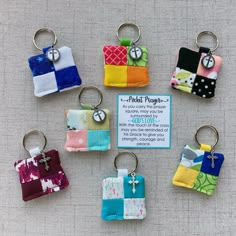 six keychains with different colors and designs on them