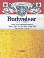 a close up of a beer glass with water droplets on it and the label budweiser