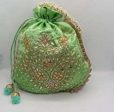 "ethnic traditional indian wedding gota patti zardosi embroider potli bag handbag for woman | potli bag for return gift | indian wedding gift Package Contents: 1 Size: 10\" x 8\" Designed with the heart, this beautiful Potli or batawa bag are eye catchy and made of premium material. Key Features: Ark Work. This potli is good match with both Indian and western outfits and are superb for wedding and festive parties. This would be best complement to your designer saree, lenhga or any other kind of Traditional Potli Bag With Dori Work For Festive Occasions, Bollywood Style Potli Bag With Zari Work For Diwali, Bollywood Style Zari Work Potli Bag For Diwali, Handmade Potli Bag For Navratri Festival, Handmade Potli Bag For Navratri Festivities, Handmade Festive Potli Bag For Navratri, Traditional Festive Potli Bag With Dori Work, Bollywood Style Potli Bag With Zari Work For Festivals, Bollywood Style Potli Bag With Handwork For Diwali