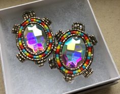 pair of colorful earrings in box on table